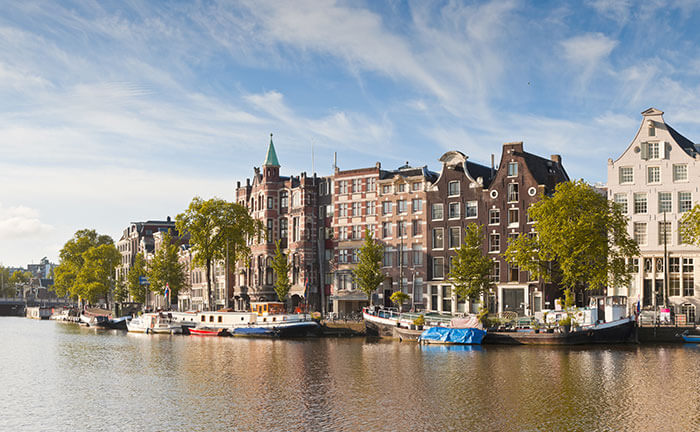 Canals and traditional houses in Amsterdam in autumn